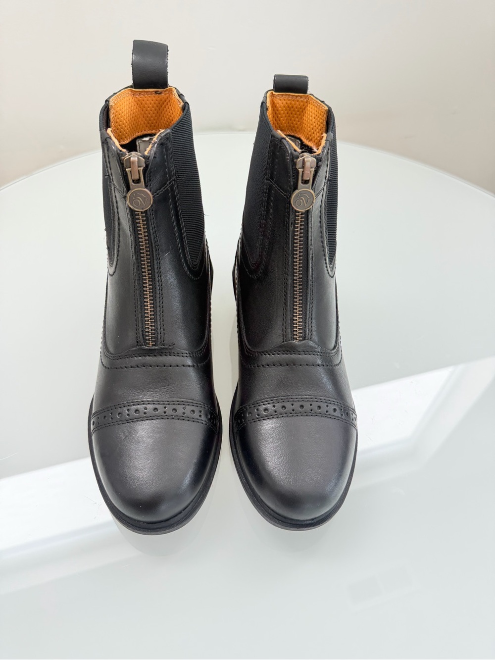 Ovation Front-Zip Black Leather Ankle Booties with Brogue Cap-Toe